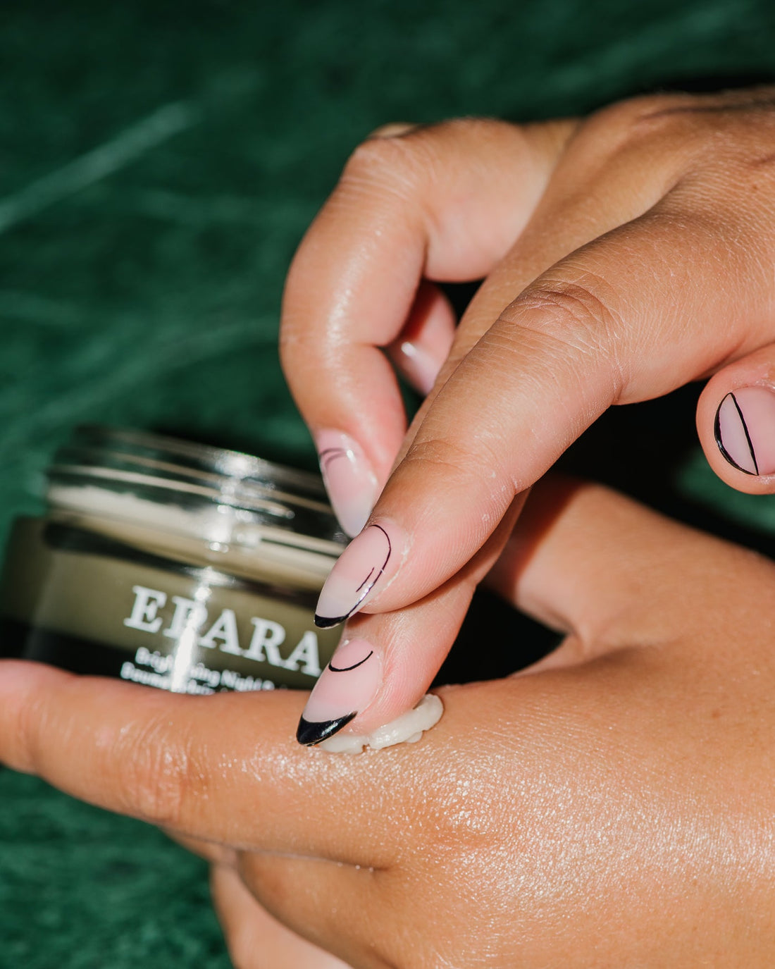 Close up of Ultra Rich Brightening Night Balm on hands.