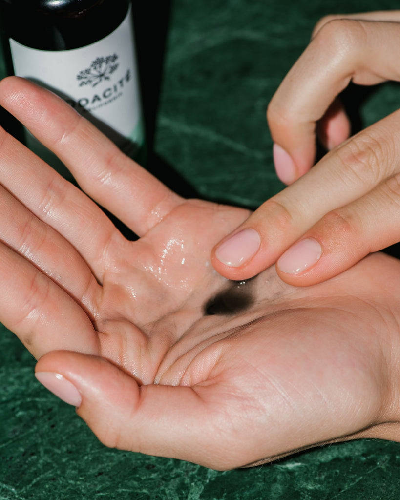 Close up of Black Mint Purifying Cleanser on skin.