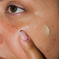 Close up of Nourishing Botanical Facial Balm on skin.
